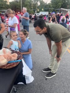 Dr. Zar, Connie and a child patient at Glen Cove's National Night Out